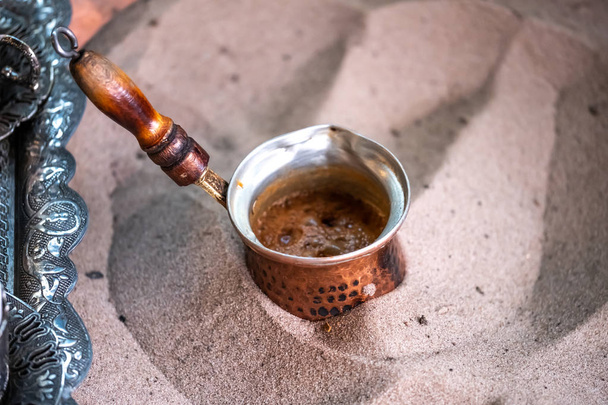 Turkish coffee preparing in the sand, Arabic style coffee preparing with sands - 写真・画像
