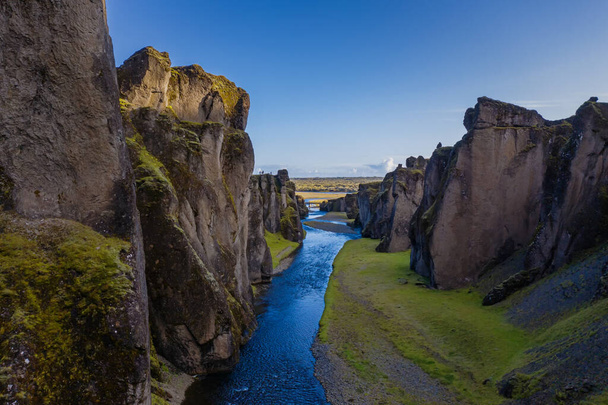 The most picturesque canyon Fjadrargljufur and the shallow creek, which flows along the bottom of the canyon. Fantastic country Iceland. September 2019. aerial drone shot - 写真・画像
