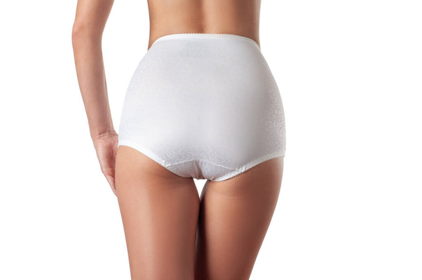 Perfect female buttocks in white underpants. Beautiful woman's butt in white underwear. - Фото, изображение