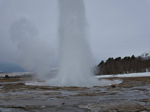 Eruption of geyser in Iceland with high fountain - Photo, Image