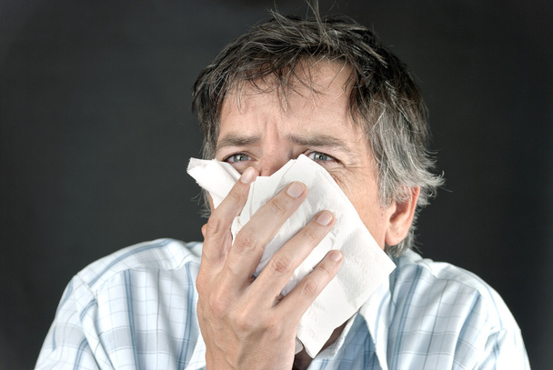Man Sneezes Into Tissue Front - Photo, Image