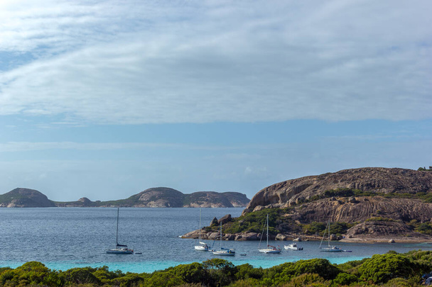 boats are on anchor at lucky bay. Overlooking Lucky Bay in Cape Le Grand National Park, Esperance, Australia - Photo, Image
