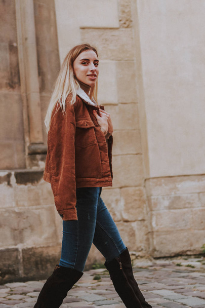 Stylish autumn fashionable image of a girl. Brown jacket with fu - Photo, Image