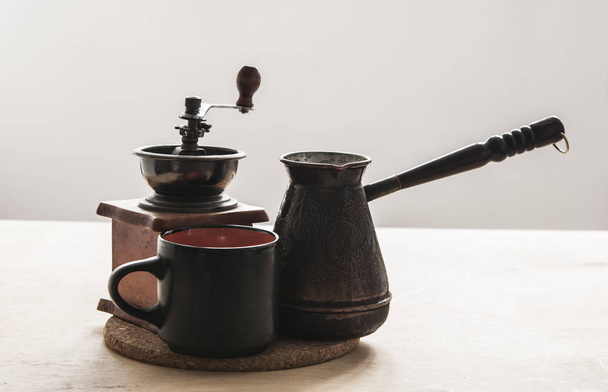 Hot turkish coffee pot on wooden table. - Fotografie, Obrázek