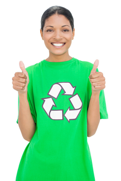 Smiling model wearing recycling tshirt giving thumbs up - Foto, Bild