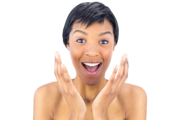 Joyful black haired woman raising her hands - Foto, imagen