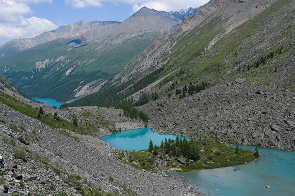 Blue lake in valley. Turquoise river in rocks. Hiking in mountains in Altai nature - Photo, Image