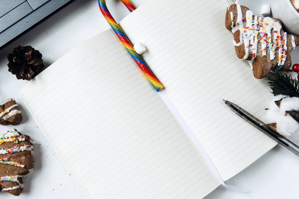 open Notepad with blank sheet, a pen, cookies in the shape of Ch - Fotó, kép