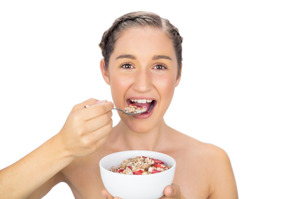 Cheerful healthy model eating cereals - Foto, immagini