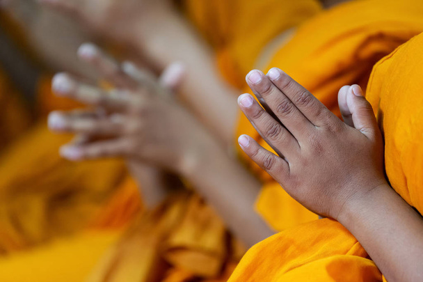 Praying Hands of boy monks amen buddhist for asian thanksgiving  - Fotó, kép