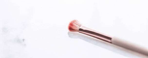 Make-up brush for foundation base face contouring on marble back - Фото, изображение
