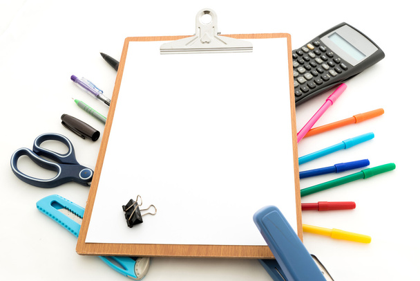 notepad with stationary objects in the background - Photo, Image