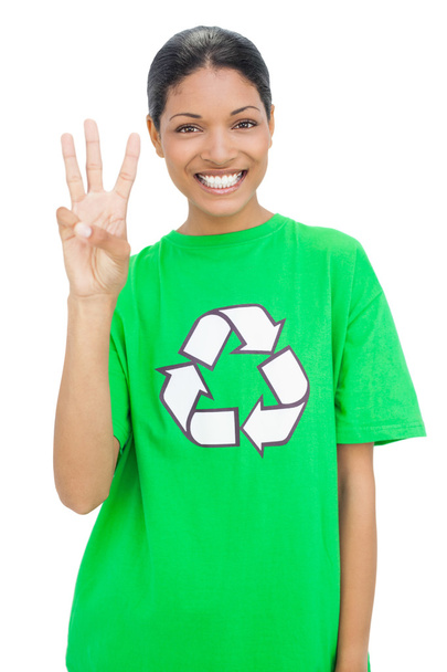Happy model wearing recycling tshirt showing three fingers - Foto, Bild