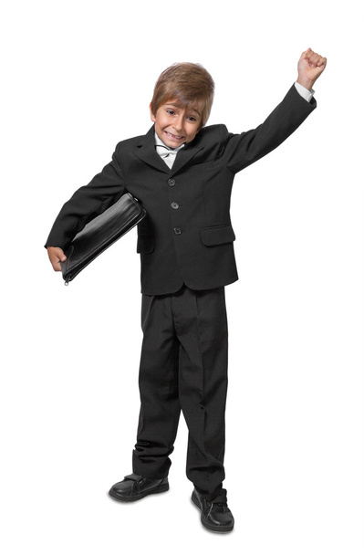Boy in a tuxedo with a folder in hands. Isolate on white backgro - Photo, Image