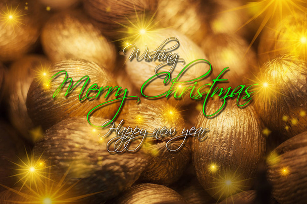 Tarjeta de felicitación de Navidad, semillas secas convertidas en adornos dorados de Navidad
 - Foto, imagen