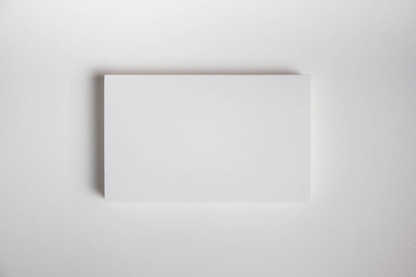 Mockup of business cards fan stack at white textured paper backg - Foto, afbeelding
