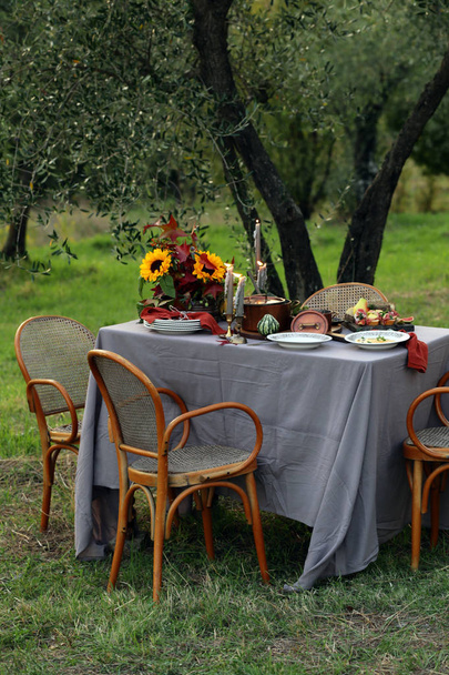 festive autumn table setting with fruits and cheese - 写真・画像