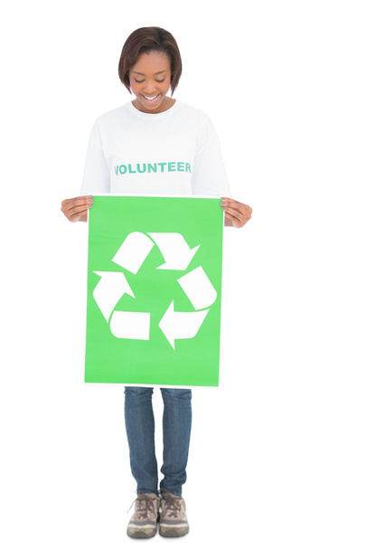 Happy volunteer woman holding recycling sign - Photo, Image