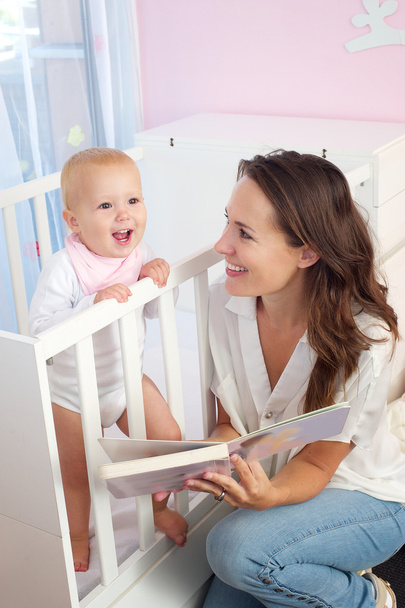 Mother reading book to baby - Photo, Image