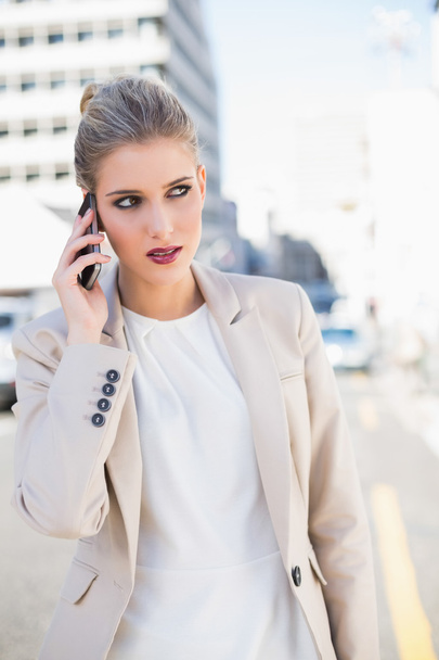Pensive gorgeous businesswoman having a phone call - Foto, Imagem