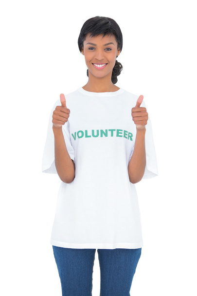 Charming black haired volunteer giving thumbs up - Photo, image
