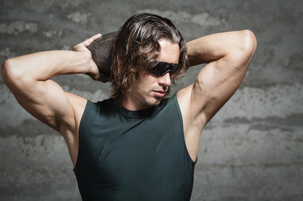 Long hair athlete wearing green tank top and sunglasses - Photo, Image