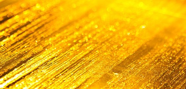 gouden achtergrond met glanzende textuur - Foto, afbeelding