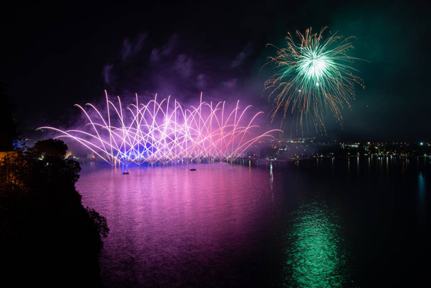 Fireworks in Riva del Garda, Italy. Annual event on the lake called "Night of fairy tales". - Photo, Image
