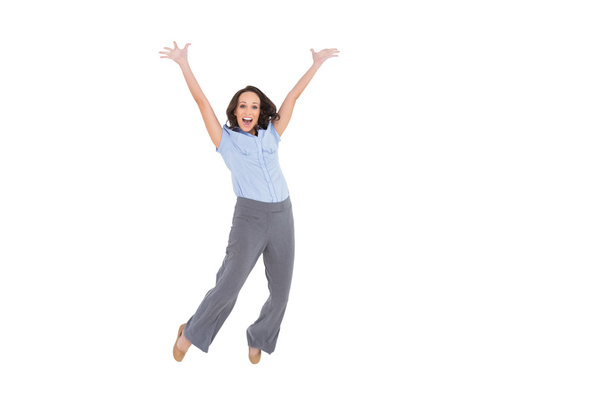 Cheerful classy businesswoman jumping - Foto, Bild