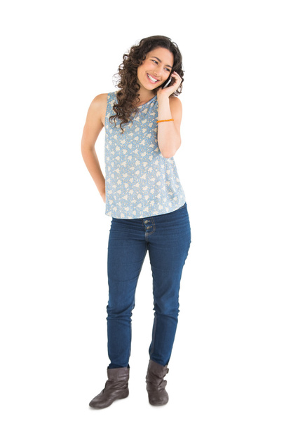 Cheerful attractive brunette on the phone - Photo, Image