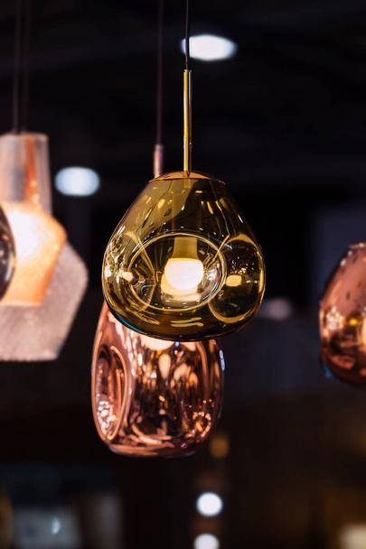 Modern streamlined mirror oval copper chandelier. Bubble metal copper gold shade pendant - Fotoğraf, Görsel