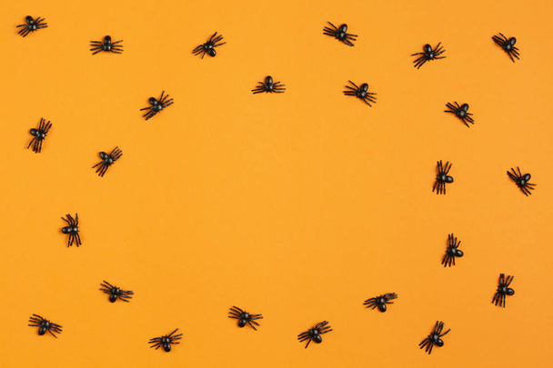 background for halloween, spiders on an orange table - Valokuva, kuva