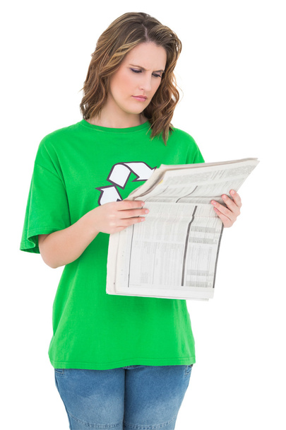 Concentrated environmental activist reading newspaper - Foto, Bild