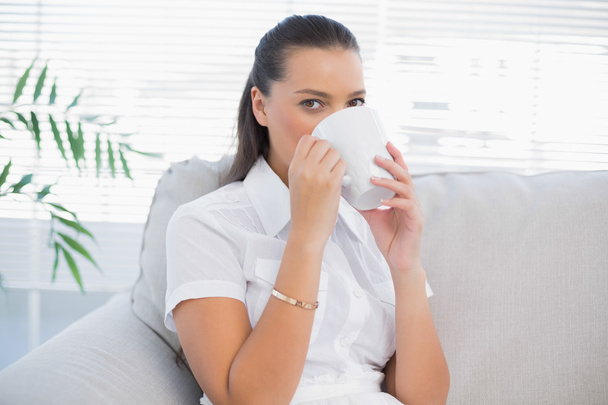 Peaceful attractive woman drinking coffee - Foto, imagen