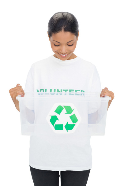 Happy model wearing volunteer tshirt holding recycling box - Foto, Bild
