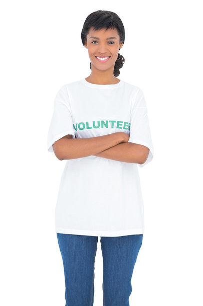 Pleased black haired volunteer posing with crossed arms - Фото, изображение