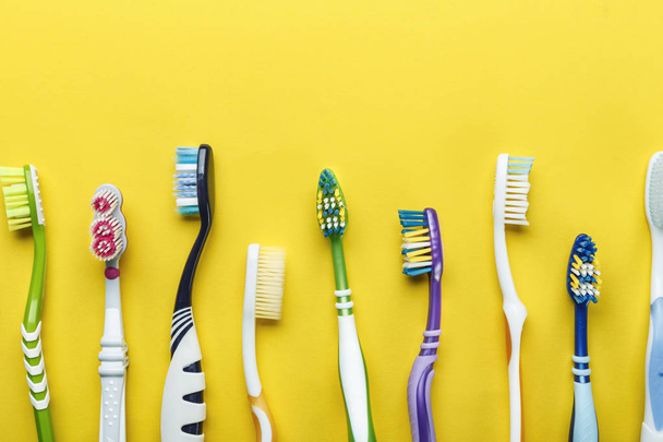 different toothbrushes on a bright background - Foto, imagen