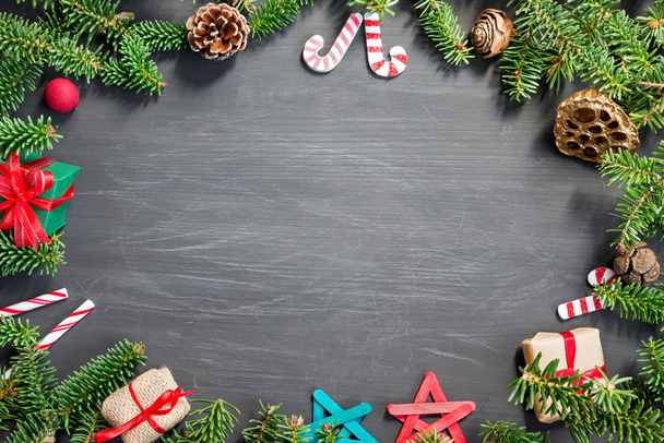 Christmas fir tree with decorations on a wooden background - Φωτογραφία, εικόνα