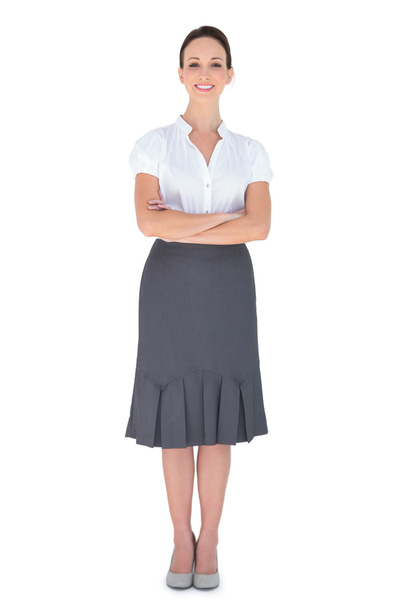 Cheerful businesswoman posing crossing arms - Photo, image