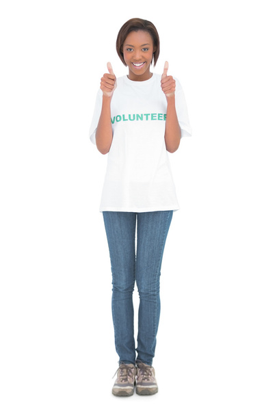 Woman wearing volunteer tshirt giving thumbs up - 写真・画像