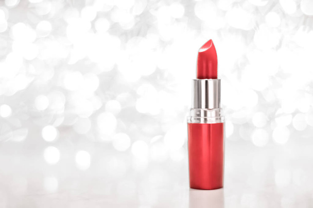 Coral lipstick on silver Christmas, New Years and Valentines Day - Photo, Image
