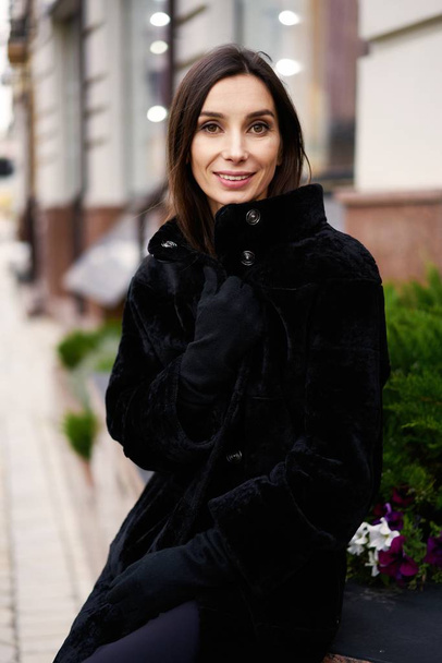 young beautiful woman posing on the street - 写真・画像