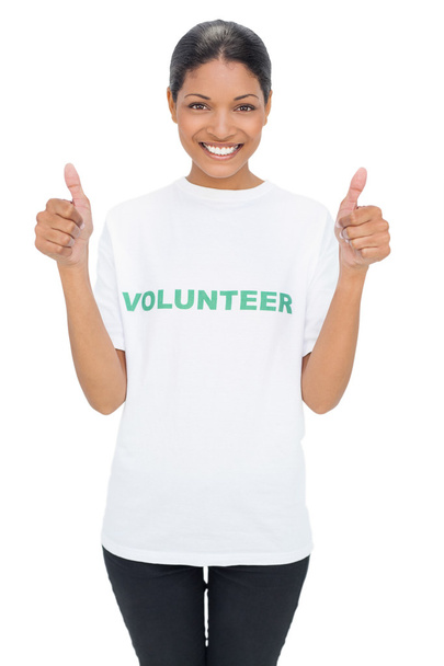 Smiling model wearing volunteer tshirt giving thumbs up - Foto, afbeelding