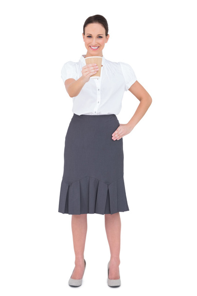 Smiling businesswoman offering coffee - Photo, Image