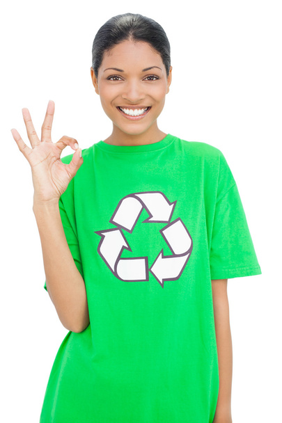 Happy model wearing recycling tshirt making okay gesture - Foto, Bild