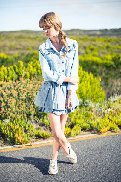 Reserved attractive blonde posing on the roadside - 写真・画像
