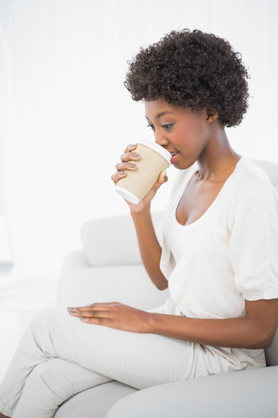 Thoughtful gorgeous brunette drinking coffee - Фото, изображение