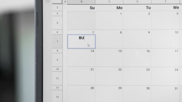 Zapisování schůze Bussines 7. na kalendář pro zapamatování tohoto data. - Záběry, video