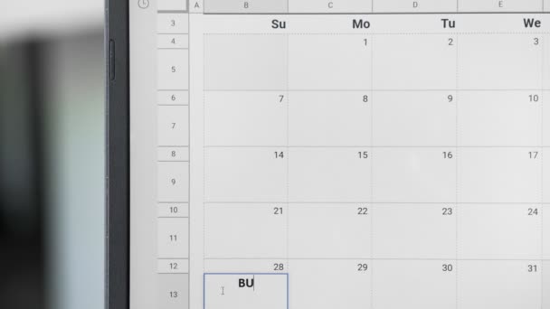 Zapisuje se schůzka Bussines 28. na kalendář pro zapamatování tohoto data. - Záběry, video