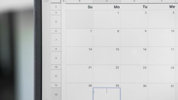 Pisanie Bussines Spotkanie w dniu 29 w kalendarzu, aby zapamiętać tę datę. - Materiał filmowy, wideo
